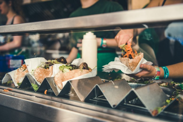 An array of soft tacos at a #DLXXII food stall