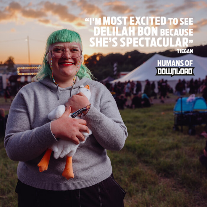 Download fan Tiegan striking a pose with caption text: 'I'm most excited to see Delilah Bon because she's spectacular.' - Tiegan - House of Download