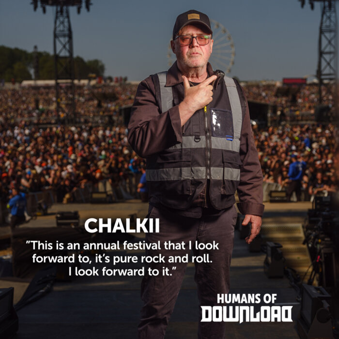 Download security Chalkii striking a pose with caption text: 'This is an annual festival that I look forward to, it's pure rock and roll. I look forward to it.' - Chalkii - Humans of Download