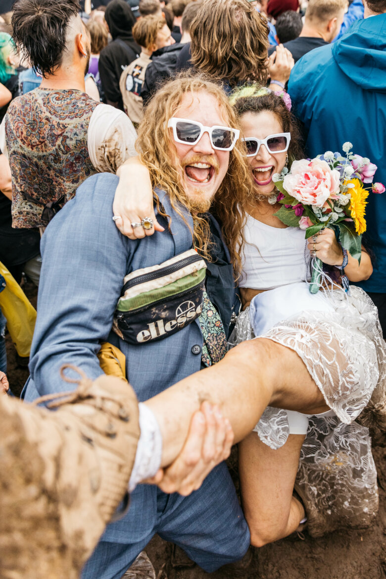 Festival go-er couple posing for the camera