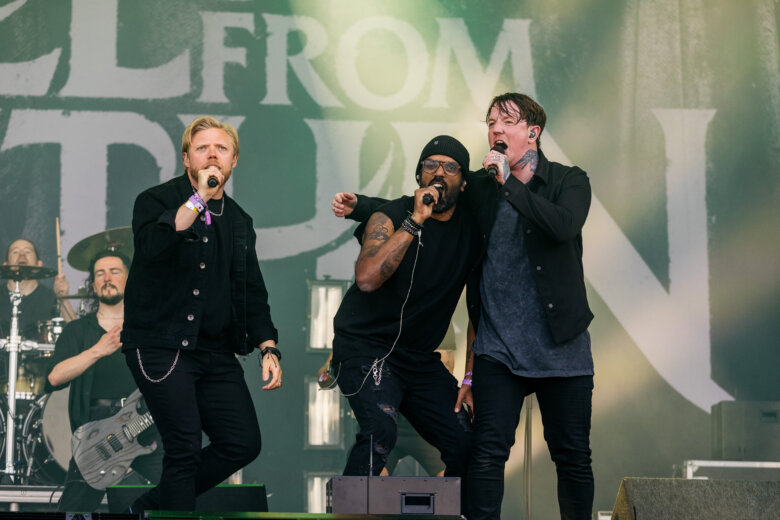 Comedians Rob Beckett and Romesh Ranganathan on stage with Bleed From Within