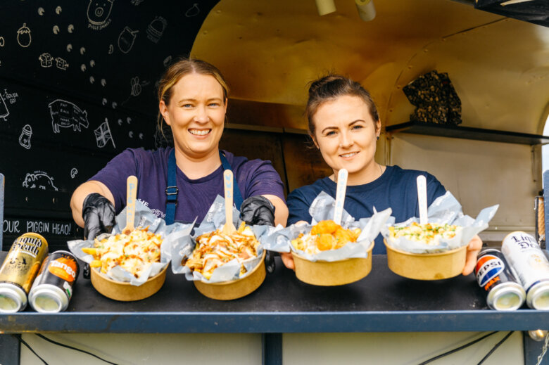 Food vendors displaying an array of food items 