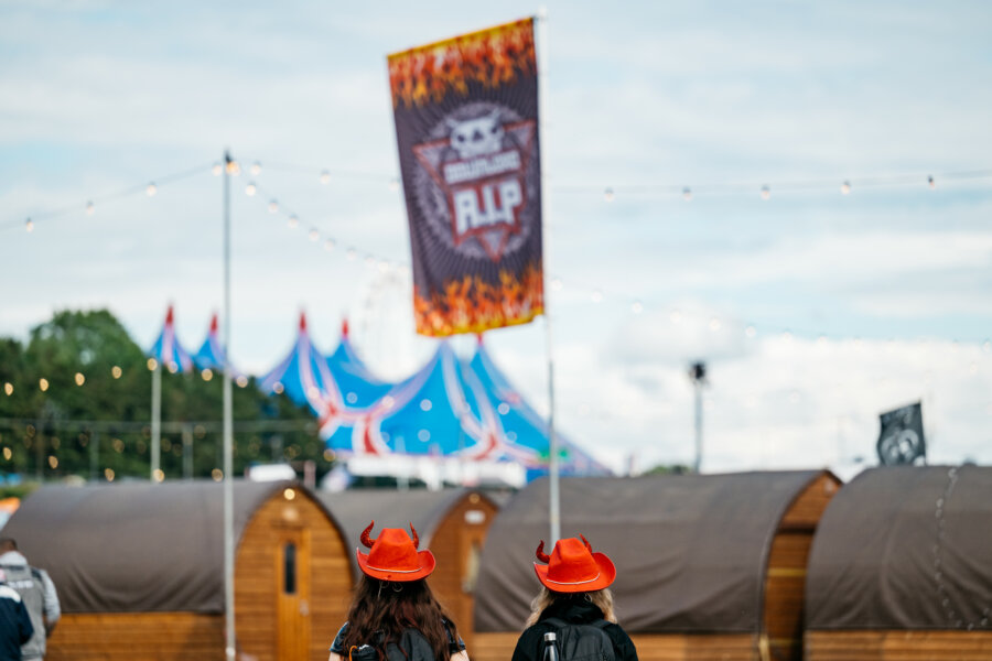 Photograph of two campers walking towards the RIP campsite