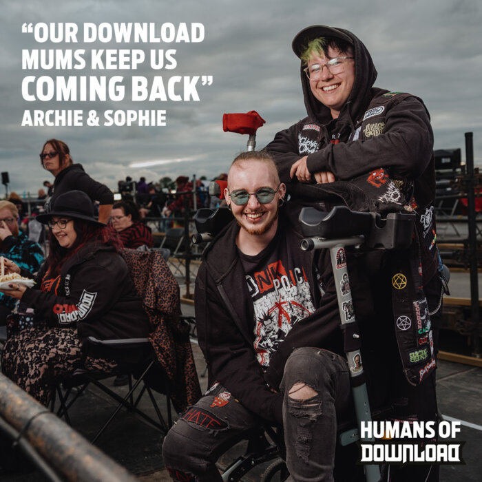 Download fans Archie and Sophie striking a pose with caption text: 'Our Download mums keep us coming back.' - Archie and Sophie - Humans of Download