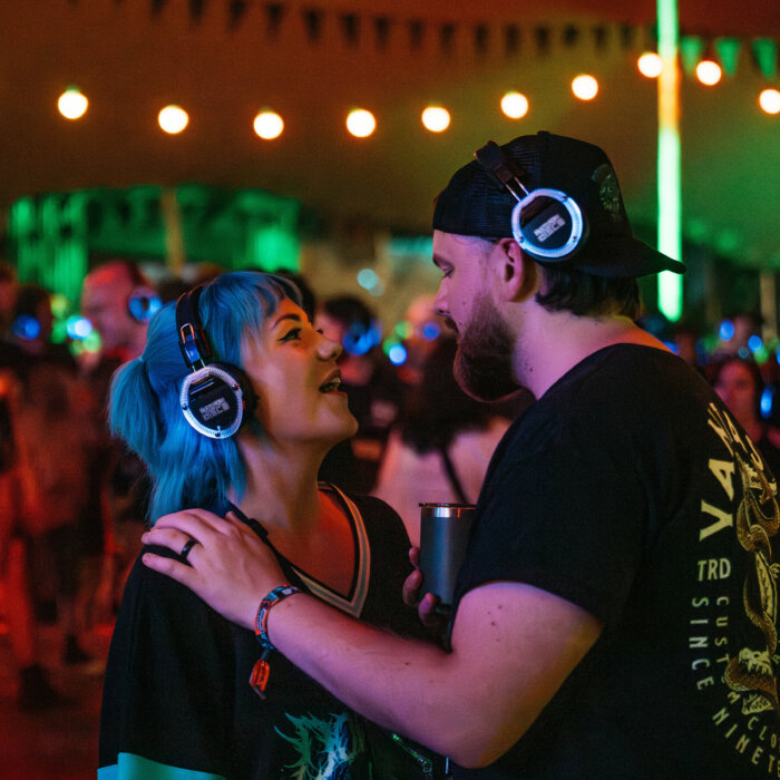 Two Download fans enjoying a silent disco.