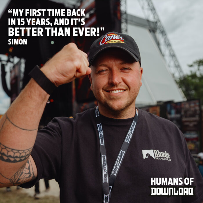 Download fan striking a pose with caption text: ‘My first time back in 15 years, and it's better than ever!' - Simon - Humans of Download